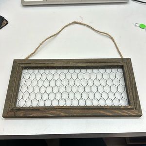 Chicken wire frame hang your earrings on.